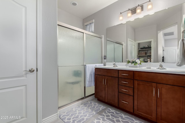 2597 E Hickory St, Gilbert, AZ 85298 - bathroom with a shower stall, double vanity, and a closet
