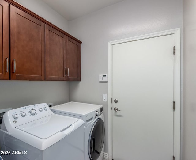 2597 E Hickory St, Gilbert, AZ 85298 - laundry area with cabinet space and washing machine and dryer