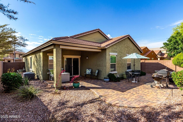 2597 E Hickory St, Gilbert, AZ 85298 - back of property with stucco siding, a tile roof, a patio, and cooling unit
