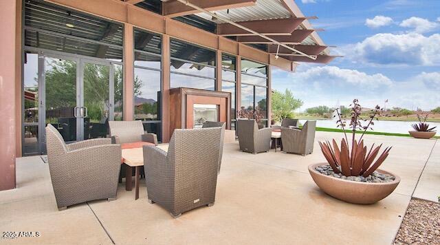 2597 E Hickory St, Gilbert, AZ 85298 - view of patio / terrace featuring outdoor dining space, french doors, and a water view