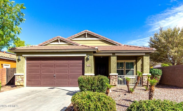 2597 E Hickory St, Gilbert, AZ 85298 - single story home with concrete driveway, covered porch, stone siding, a garage, and a tile roof