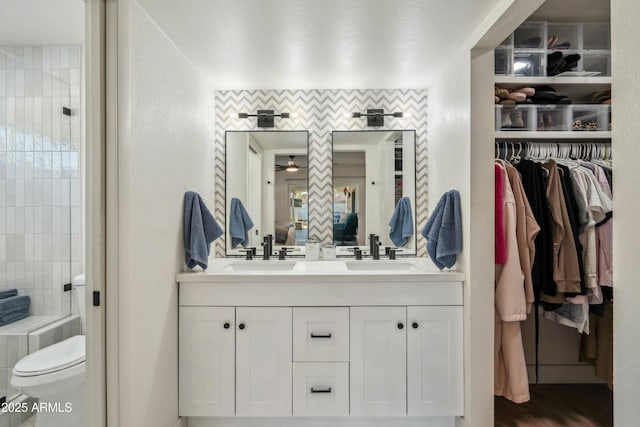 bathroom with toilet and vanity