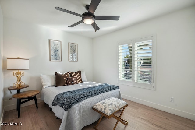 bedroom featuring ceiling fan and light hardwood / wood-style floors