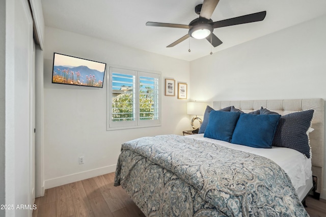 bedroom featuring light hardwood / wood-style flooring, a closet, and ceiling fan