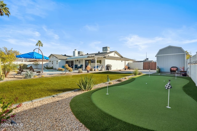 view of home's community featuring a yard, a patio, and a swimming pool