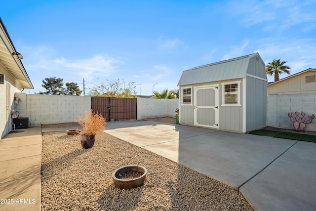 view of yard featuring a patio area and a shed