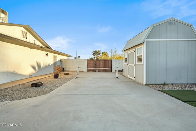 view of patio with a storage shed