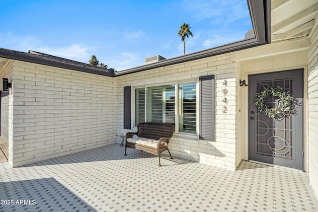 doorway to property with a patio area