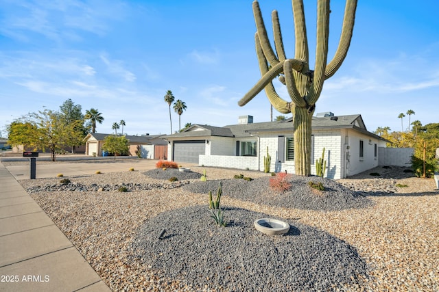 ranch-style home featuring a garage