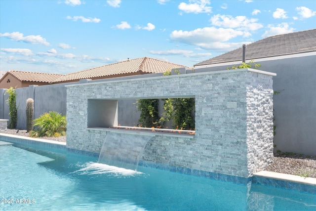 view of pool featuring fence and a fenced in pool