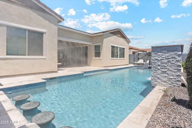 pool with a patio area