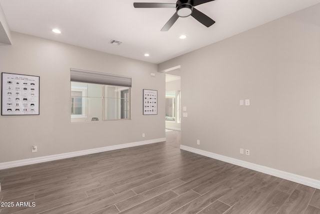 spare room featuring visible vents, baseboards, ceiling fan, wood finished floors, and recessed lighting