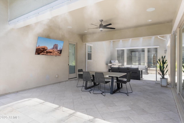 view of patio / terrace featuring outdoor lounge area, outdoor dining space, and ceiling fan