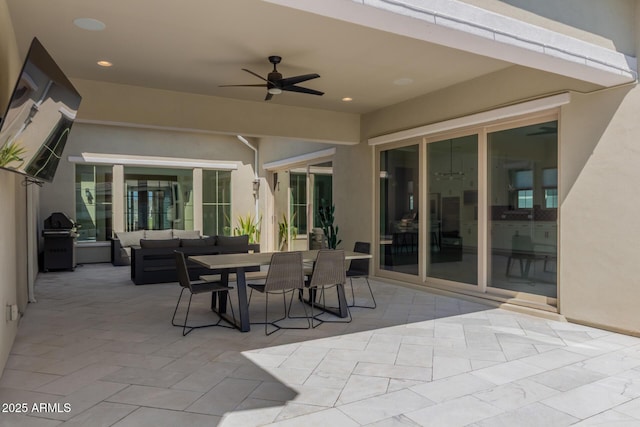 view of patio / terrace featuring outdoor dining space, an outdoor living space, and ceiling fan