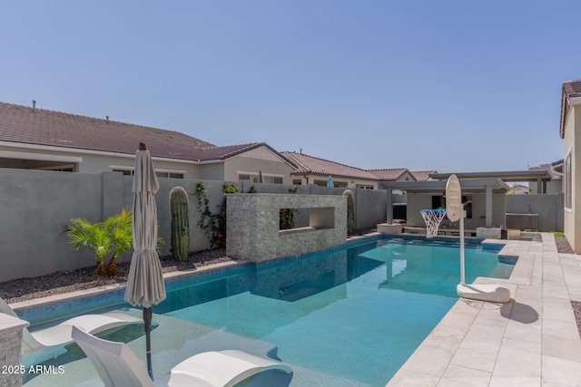 view of swimming pool with a fenced in pool, a fenced backyard, and a patio area