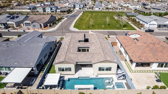 birds eye view of property with a residential view