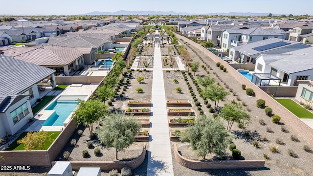 birds eye view of property with a residential view