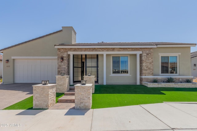 view of front of house with stucco siding, an attached garage, stone siding, driveway, and a front lawn
