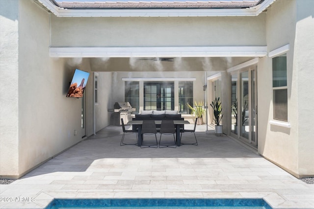 view of patio / terrace featuring a grill and outdoor dining area
