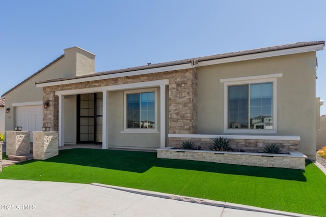 view of front facade with stucco siding and stone siding