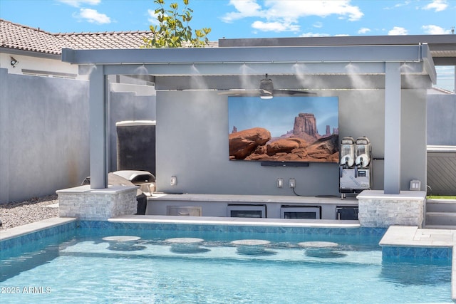 outdoor pool featuring an outbuilding, area for grilling, and an exterior structure