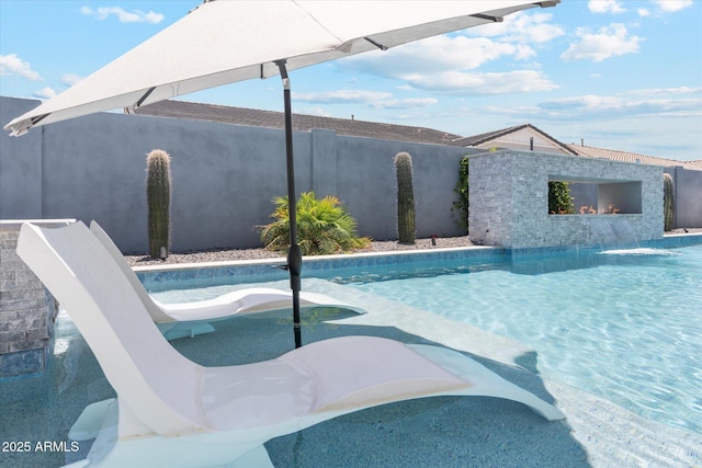 view of swimming pool featuring a fenced in pool and a fenced backyard