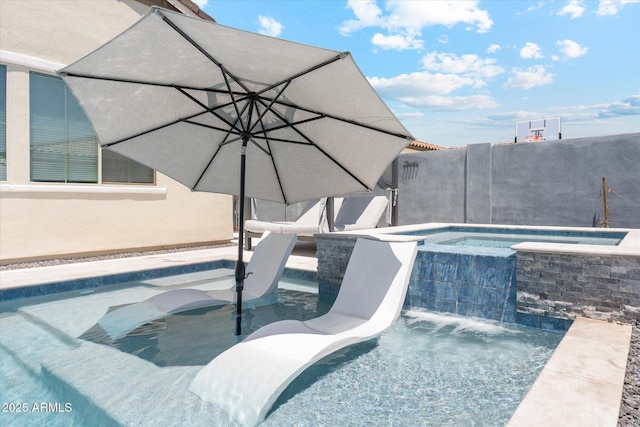 view of swimming pool featuring a pool with connected hot tub