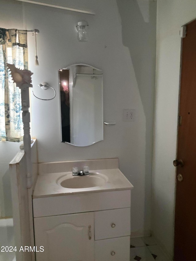 bathroom with vanity and tile patterned flooring