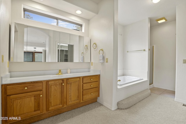 full bathroom with carpet, a garden tub, a shower with shower door, vanity, and baseboards