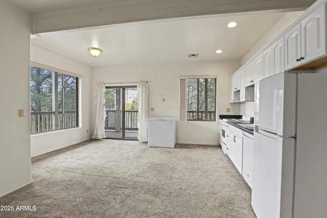 kitchen featuring recessed lighting, light carpet, white appliances, visible vents, and white cabinets