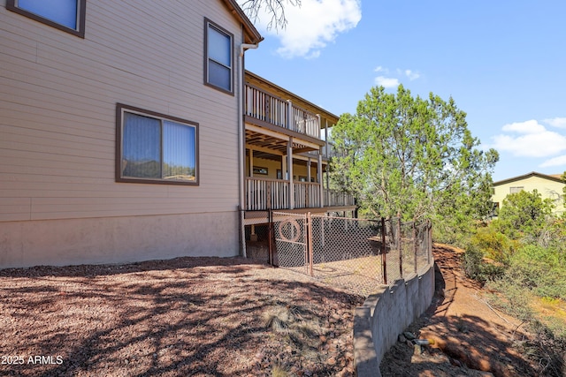 view of side of home featuring a wooden deck