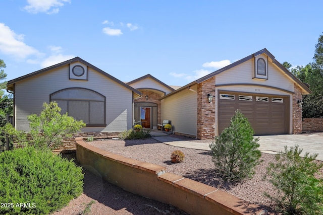 view of front of property with a garage and concrete driveway