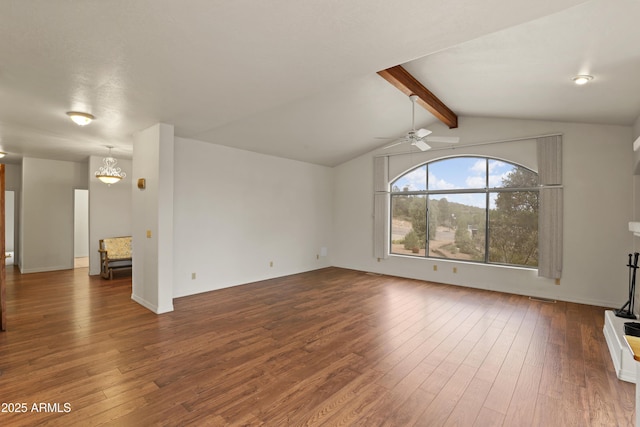 unfurnished living room featuring ceiling fan with notable chandelier, dark wood-style flooring, visible vents, and vaulted ceiling with beams