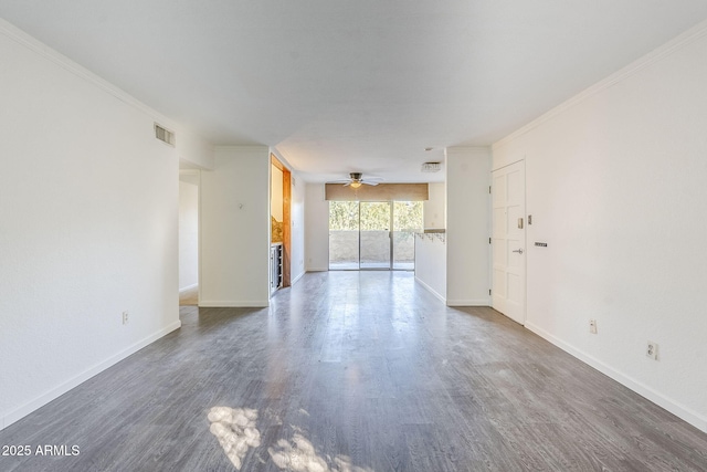 unfurnished room with crown molding, ceiling fan, and dark hardwood / wood-style floors