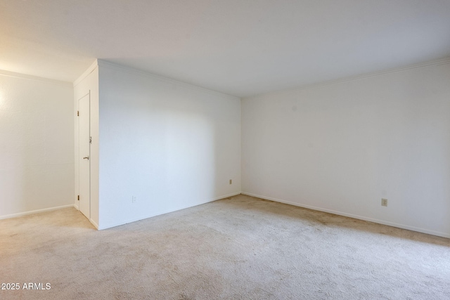 carpeted spare room with ornamental molding