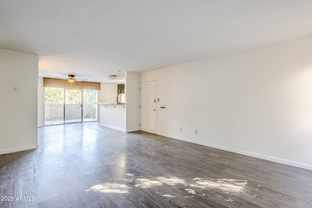 unfurnished living room with crown molding, ceiling fan, and dark hardwood / wood-style flooring