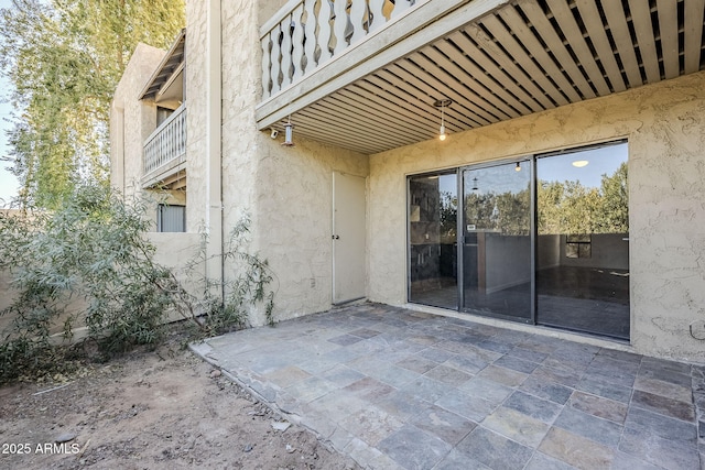 view of patio / terrace with a balcony