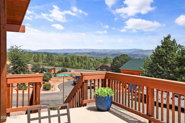 wooden deck with a mountain view