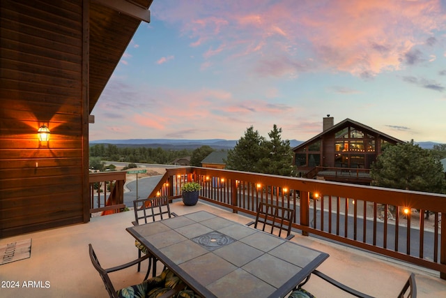 patio terrace at dusk with a balcony