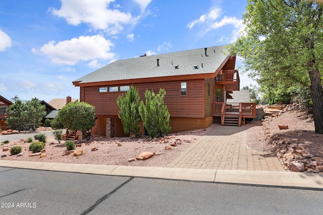 view of front of home featuring a wooden deck