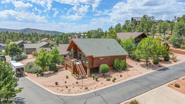 birds eye view of property with a mountain view