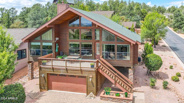 log home featuring a garage