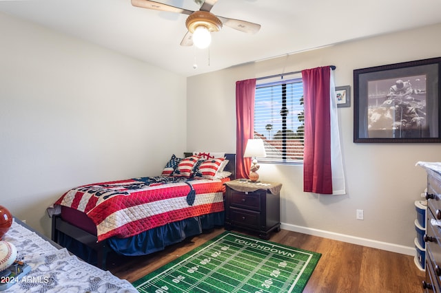 bedroom featuring dark hardwood / wood-style flooring and ceiling fan