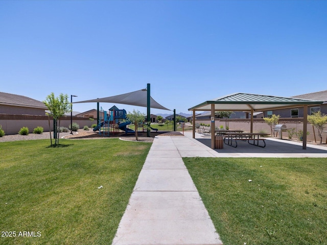 view of community featuring a playground, a gazebo, and a yard