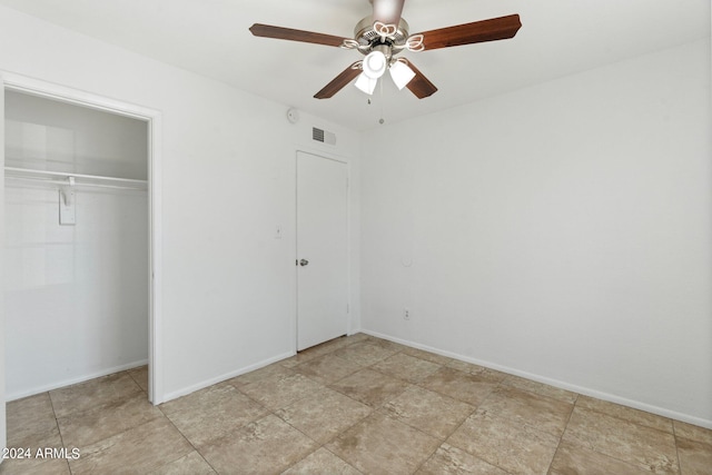 unfurnished bedroom featuring a closet and ceiling fan