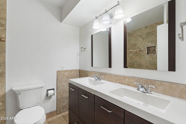 bathroom featuring tile patterned floors, vanity, and toilet