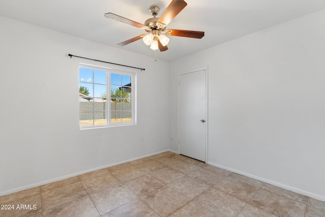 spare room with ceiling fan