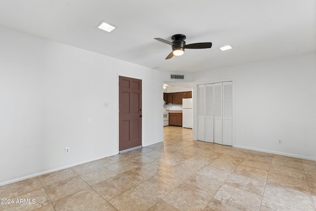 unfurnished room featuring ceiling fan