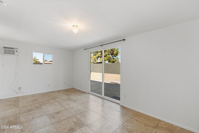 spare room with a wall unit AC