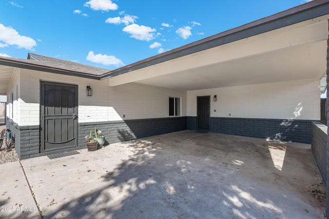 exterior space with a carport